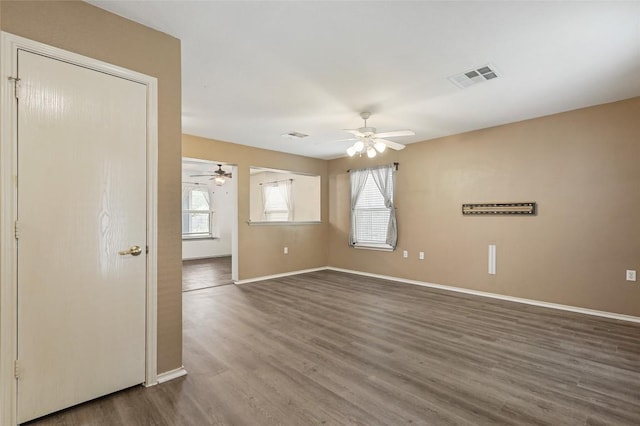 17737 Golden Valley Dr, Manor, TX 78653 - empty room featuring a ceiling fan and dark wood-style flooring