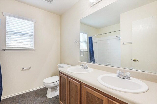 17737 Golden Valley Dr, Manor, TX 78653 - full bathroom with double vanity, curtained shower, and tile patterned flooring