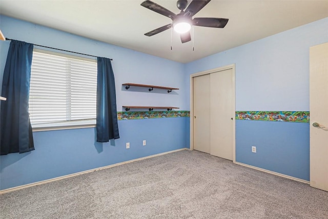 17737 Golden Valley Dr, Manor, TX 78653 - unfurnished bedroom featuring carpet, a closet, and a ceiling fan