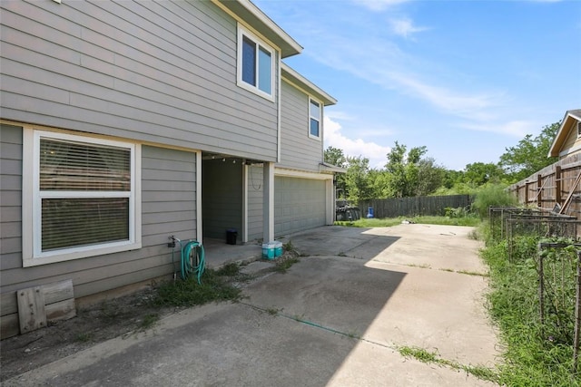17737 Golden Valley Dr, Manor, TX 78653 - view of side of home with driveway and a garage