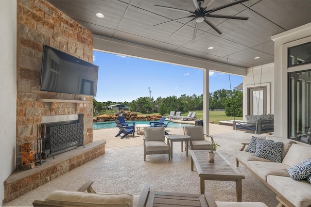 205 Honey Locust Cv, Leander, TX 78641 - view of patio / terrace with an outdoor living space with a fireplace, a ceiling fan, and an outdoor pool