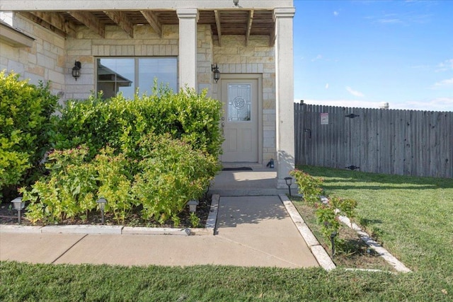 212 Plata Ln, Jarrell, TX 76537 - doorway to property featuring stone siding