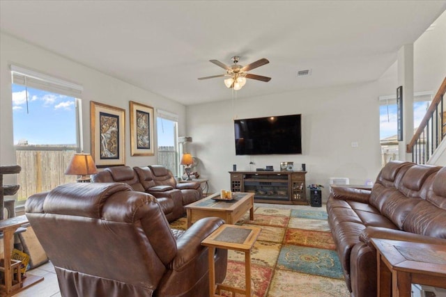 212 Plata Ln, Jarrell, TX 76537 - living area featuring a ceiling fan, plenty of natural light, and stairs