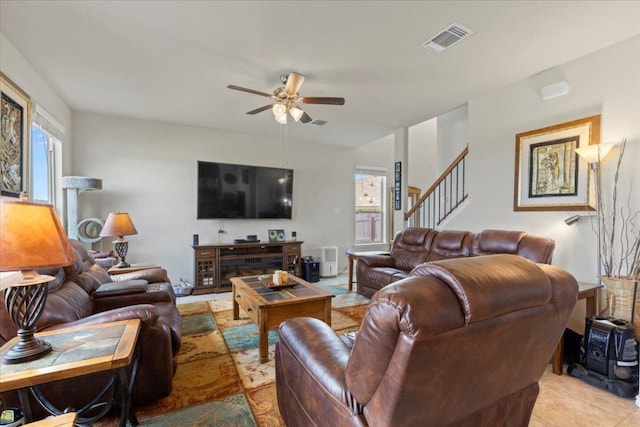 212 Plata Ln, Jarrell, TX 76537 - living room featuring ceiling fan and stairs
