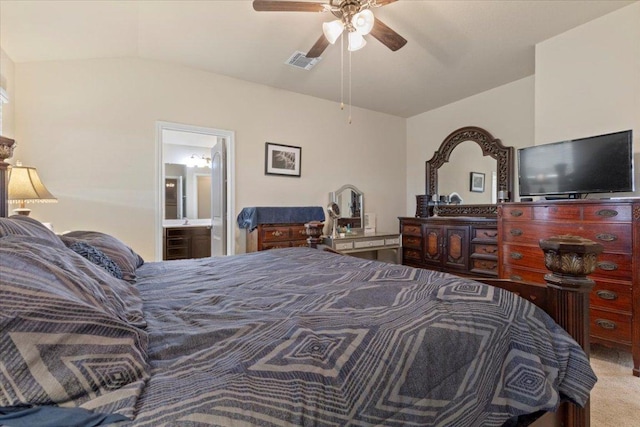 212 Plata Ln, Jarrell, TX 76537 - carpeted bedroom featuring lofted ceiling, connected bathroom, and a ceiling fan