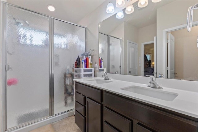 212 Plata Ln, Jarrell, TX 76537 - full bathroom featuring a stall shower, double vanity, and tile patterned flooring