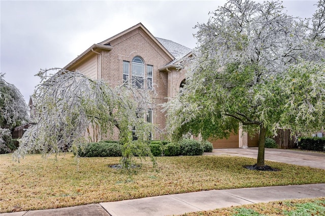 903 Fork Ridge Path, Round Rock, TX 78665 - view of front facade with brick siding, concrete driveway, and a garage