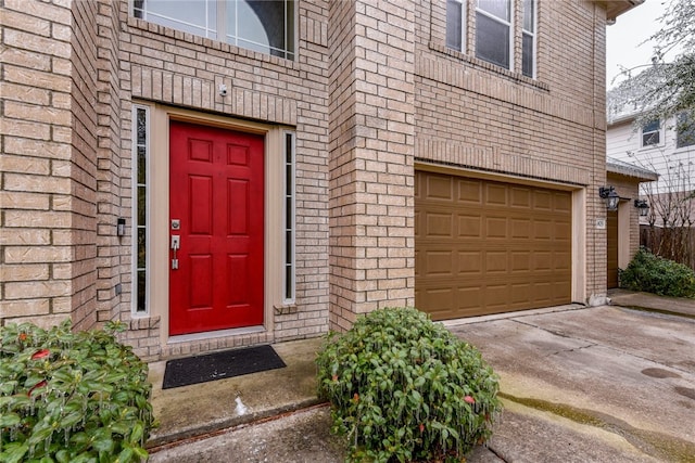 903 Fork Ridge Path, Round Rock, TX 78665 - view of exterior entry featuring concrete driveway, an attached garage, and brick siding