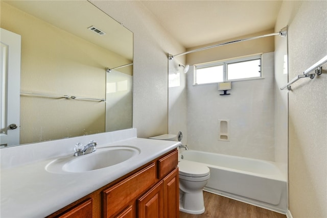 903 Fork Ridge Path, Round Rock, TX 78665 - bathroom with tub / shower combination, vanity, and wood finished floors