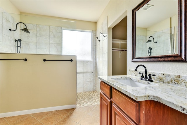 903 Fork Ridge Path, Round Rock, TX 78665 - bathroom with walk in shower, vanity, and tile patterned flooring