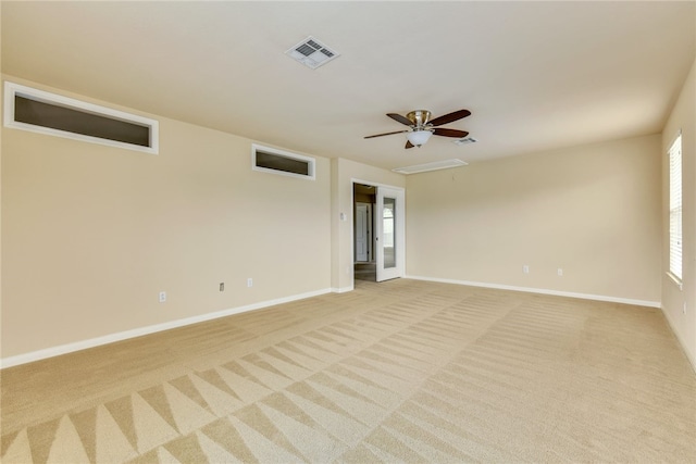 903 Fork Ridge Path, Round Rock, TX 78665 - spare room featuring light colored carpet, attic access, and ceiling fan