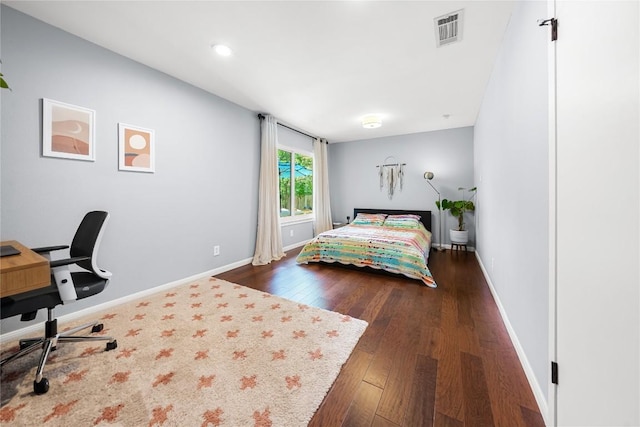 1703 Duke Ave, Austin, TX 78757 - bedroom with dark wood finished floors, a desk, and recessed lighting
