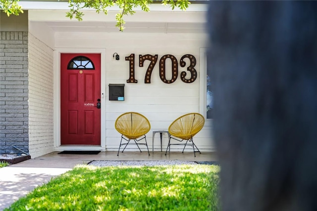 1703 Duke Ave, Austin, TX 78757 - property entrance featuring brick siding
