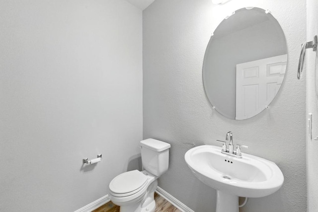 7202 Redding Dr Unit 203, Austin, TX 78745 - half bath featuring wood finished floors and toilet
