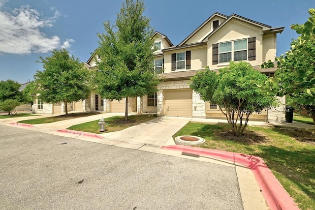 7202 Redding Dr Unit 203, Austin, TX 78745 - view of front of house with concrete driveway, stone siding, stucco siding, and a garage
