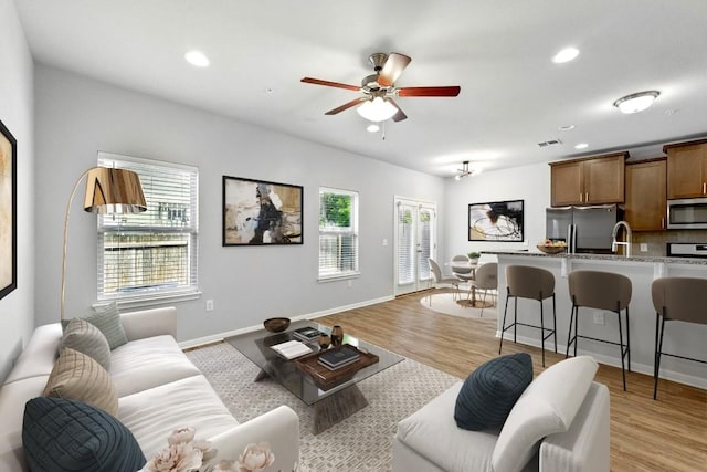 7202 Redding Dr Unit 203, Austin, TX 78745 - living area featuring a ceiling fan, recessed lighting, and light wood-style flooring