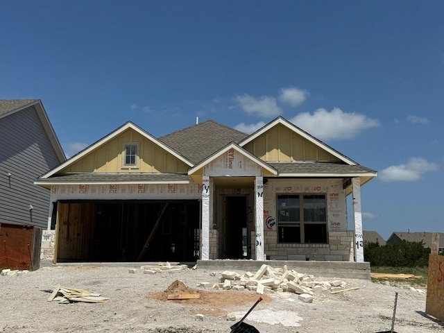 566 Sage Thrasher Cir, Dripping Springs, TX 78620 - unfinished property featuring roof with shingles, a garage, and board and batten siding