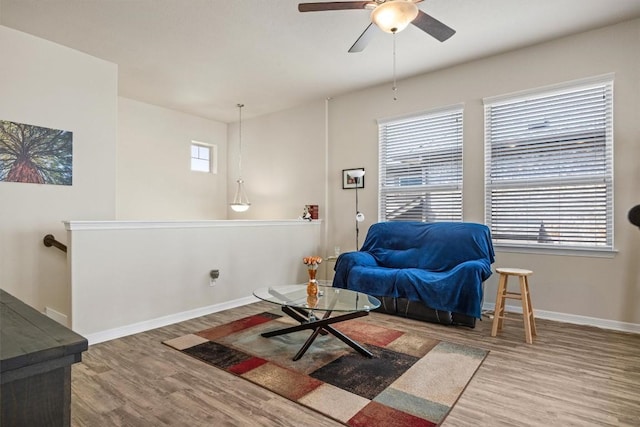 2302 Dillon Pond Ln Unit A, Pflugerville, TX 78660 - living area featuring wood finished floors, healthy amount of natural light, and a ceiling fan
