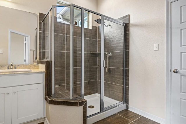 2302 Dillon Pond Ln Unit A, Pflugerville, TX 78660 - bathroom featuring a shower stall, vanity, and wood finished floors