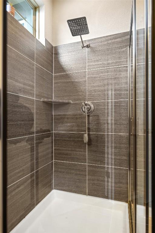 2302 Dillon Pond Ln Unit A, Pflugerville, TX 78660 - bathroom with tiled shower