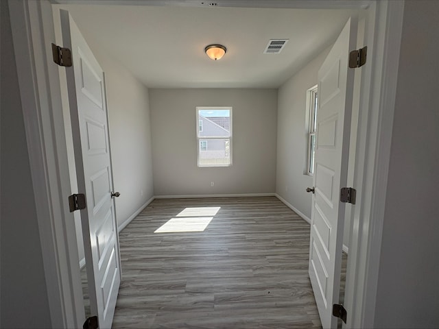 123 Elm Branch Trl, Taylor, TX 76574 - unfurnished room with wood finished floors and baseboards