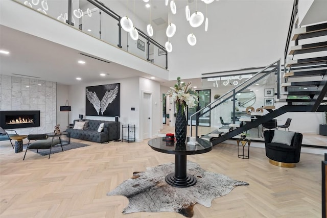 4808 Ranch Rd Unit 2222, Austin, TX 78731 - entrance foyer with stairway, a high ceiling, and a tiled fireplace