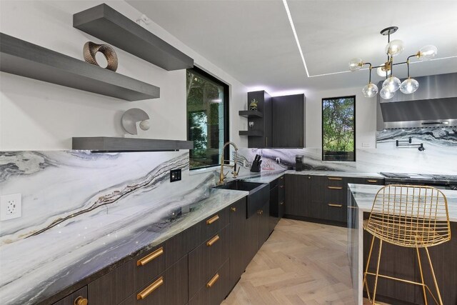 4808 Ranch Rd Unit 2222, Austin, TX 78731 - kitchen featuring open shelves, wall chimney exhaust hood, light stone counters, and modern cabinets