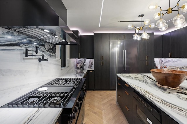 4808 Ranch Rd Unit 2222, Austin, TX 78731 - kitchen featuring island range hood, stove, high quality fridge, decorative light fixtures, and light stone countertops