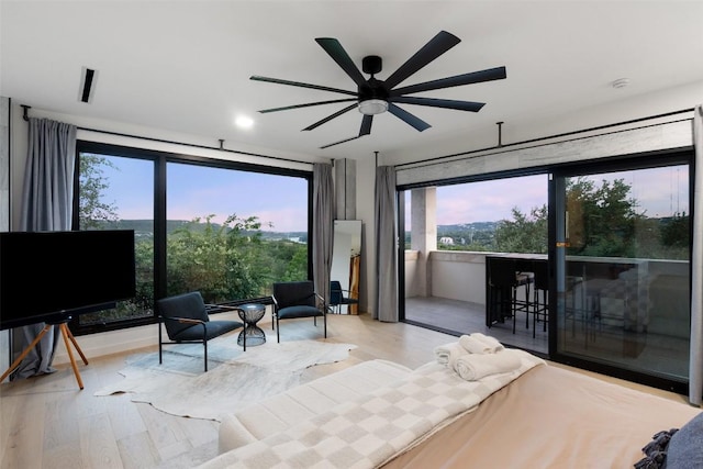 4808 Ranch Rd Unit 2222, Austin, TX 78731 - bedroom featuring multiple windows, wood finished floors, and access to outside