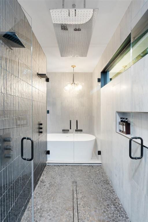 4808 Ranch Rd Unit 2222, Austin, TX 78731 - bathroom featuring a shower stall, a freestanding tub, and a chandelier