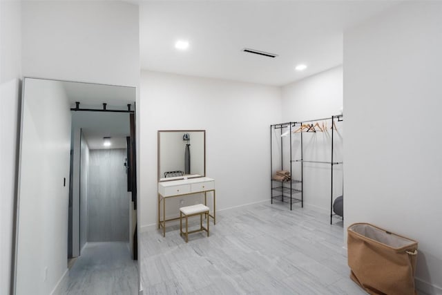 4808 Ranch Rd Unit 2222, Austin, TX 78731 - hallway with recessed lighting and a barn door