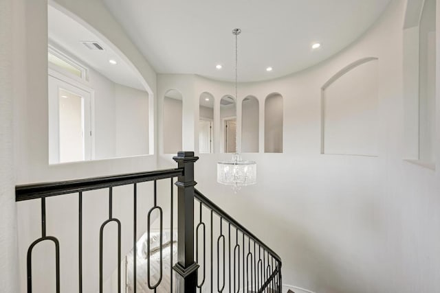 13201 Mansfield Dr, Austin, TX 78732 - stairs with a chandelier and recessed lighting
