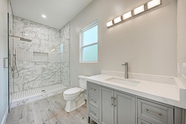 13201 Mansfield Dr, Austin, TX 78732 - bathroom with a stall shower, wood finished floors, and vanity