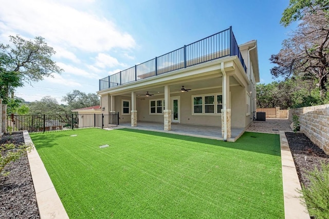 13201 Mansfield Dr, Austin, TX 78732 - back of property featuring a ceiling fan, a balcony, a fenced backyard, and a patio