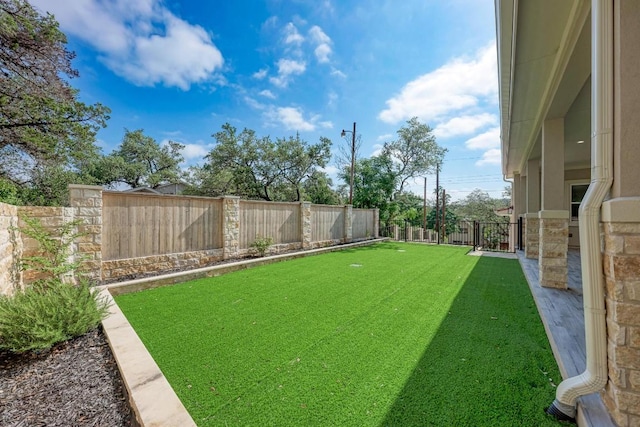 13201 Mansfield Dr, Austin, TX 78732 - fenced backyard featuring an area to practice putting