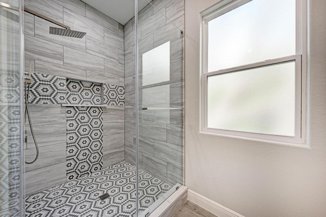 13201 Mansfield Dr, Austin, TX 78732 - bathroom with a stall shower and baseboards