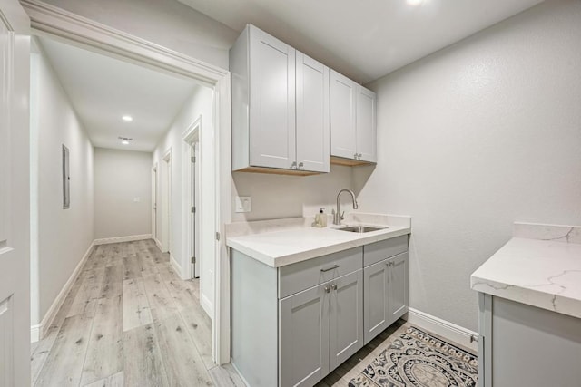 13201 Mansfield Dr, Austin, TX 78732 - washroom featuring light wood-style flooring and recessed lighting