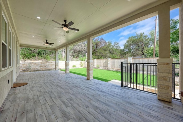 13201 Mansfield Dr, Austin, TX 78732 - deck featuring ceiling fan and a fenced backyard