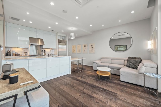 200 Congress Ave Unit 33Bb, Austin, TX 78701 - living area featuring dark wood finished floors and recessed lighting