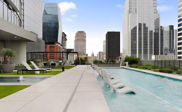 200 Congress Ave Unit 33Bb, Austin, TX 78701 - community pool featuring a view of skyline