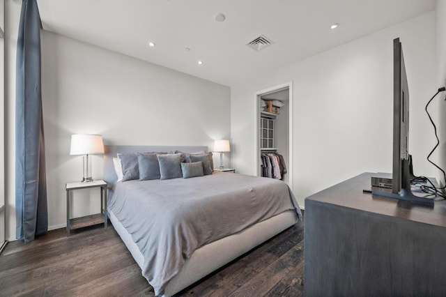 200 Congress Ave Unit 33Bb, Austin, TX 78701 - bedroom featuring dark wood-style flooring, recessed lighting, a spacious closet, and a closet