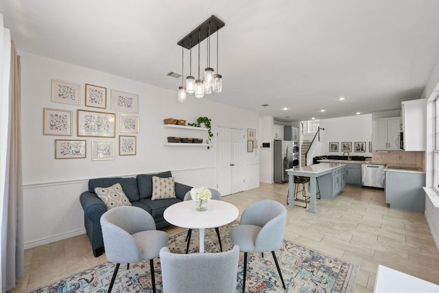 2308 Windswept Dr, Austin, TX 78738 - dining area with recessed lighting, stairs, and a chandelier