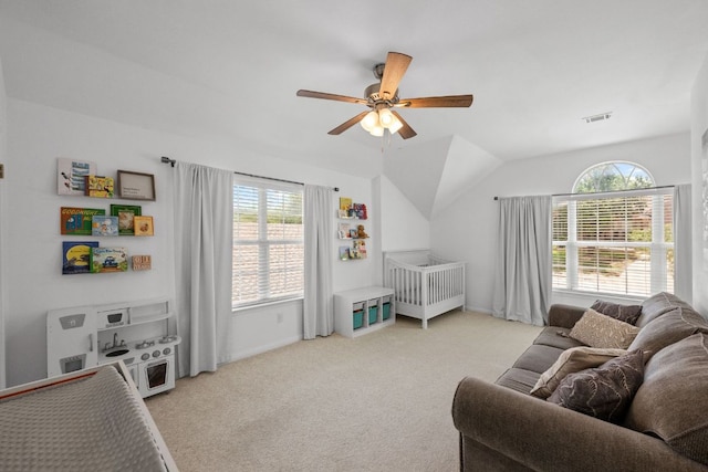 2308 Windswept Dr, Austin, TX 78738 - bedroom with multiple windows, light carpet, vaulted ceiling, and ceiling fan