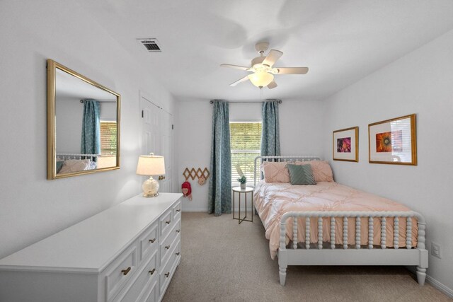 2308 Windswept Dr, Austin, TX 78738 - bedroom featuring light colored carpet and a ceiling fan
