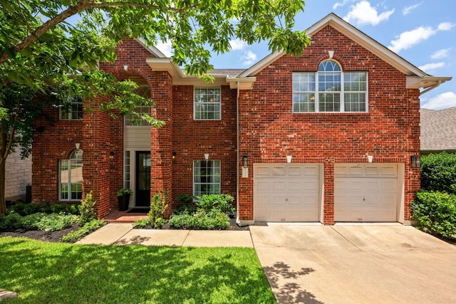 2308 Windswept Dr, Austin, TX 78738 - view of front of house with driveway, brick siding, an attached garage, and a front yard