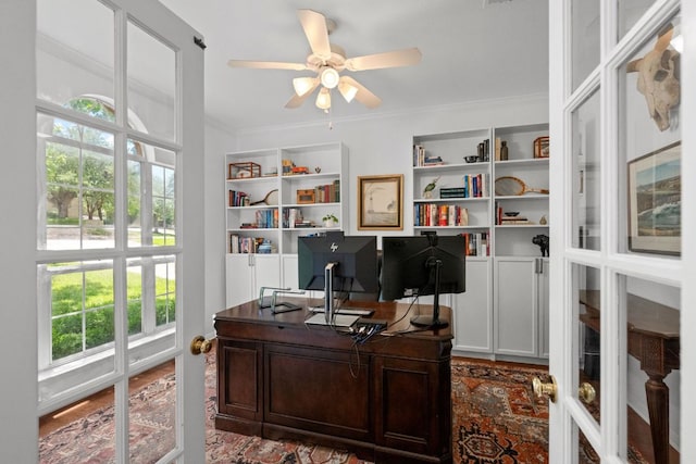 2308 Windswept Dr, Austin, TX 78738 - home office featuring ceiling fan, crown molding, plenty of natural light, and built in shelves