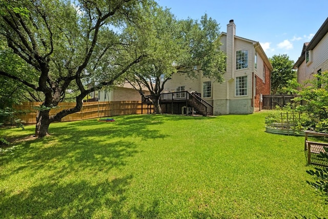 2308 Windswept Dr, Austin, TX 78738 - fenced backyard featuring stairs, a garden, and a wooden deck