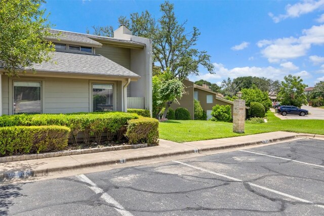 100 Lido Cir Unit B-1, Lakeway, TX 78734 - view of building exterior with uncovered parking