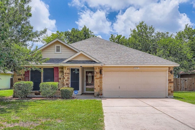 1229 Twin Cv, Kyle, TX 78640 - single story home featuring roof with shingles, an attached garage, driveway, and stone siding