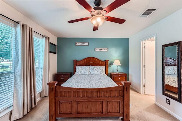 1229 Twin Cv, Kyle, TX 78640 - bedroom featuring light colored carpet and a ceiling fan